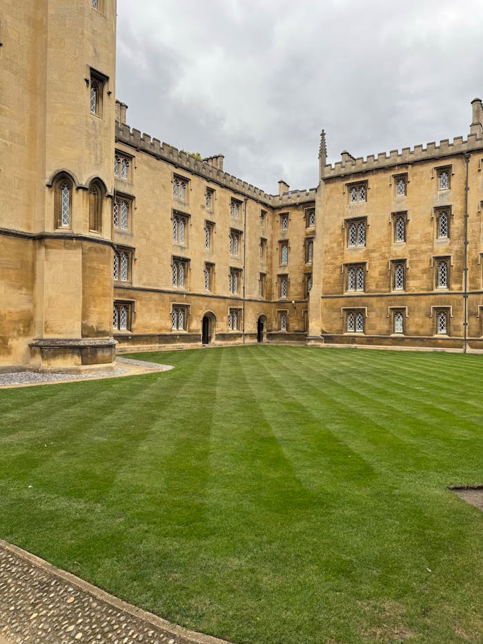 Elegant historic buildings and courtyard at Cambridge University, England.